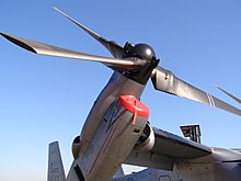 A closeup of an MV-22B’s rotor and engine tilted slightly upward.