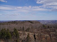 View looking east from the top of West Peak. East Peak and South Mountain, the lower peaks, are visible.