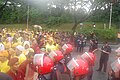 The police form a human line near the National Palace.