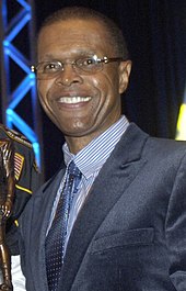 Gale Sayers giving a speech in 2008