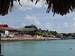 View of waterfront including Fish Market and World War II Monument on the right.