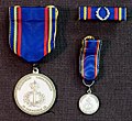 Military Academy Karlberg Medal of Merit in silver with ribbon and miniature medal (obverse)