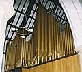 The West-facing pipe-front of the current organ, showing the stencilled pipes behind the front