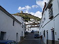 Street in Jimena, with castle at the end