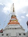 Another minor chedi on the junk, decorated with flags