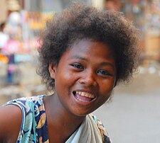 Ati girl going around the town of Kalibo on Panay island in central Philippines.