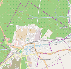 Mapa konturowa Pionek, blisko centrum na lewo znajduje się punkt z opisem „KościółNajświętszej Maryi PannyKrólowej Polski”