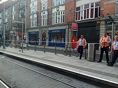 Luas ticket inspectors await a tram at Abbey Street