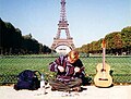 Making hemp bracelets for tourists at the Eiffel Tower in Paris, France.