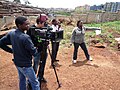 Image 3Filmmaker Nathan Collett (with camera) shooting feature film Togetherness Supreme in collaboration with Kibera youth trainees. (from Culture of Kenya)