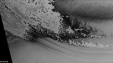 Defrosting going on in Playfair crater, as seen by CTX camera (on Mars Reconnaissance Orbiter). Dark areas are where frost has disappeared thereby showing dark ground. Note: this is an enlargement of the previous image of Playfair crater.