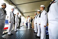 Sideboys await their command to render honors aboard Mount Whitney