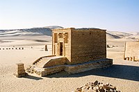 Remains of a tomb in a desert setting