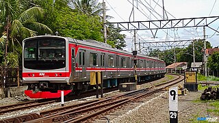 205 series (later design, unofficially called "Marchen face") trainset BUD146 (Formerly trainset KeYo M62) entering Serpong Station.