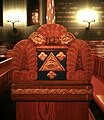 The decoration on the end of a pew.