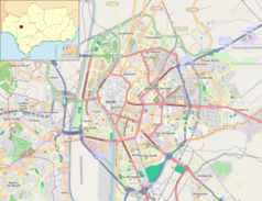 Mapa konturowa Sewilli, w centrum znajduje się punkt z opisem „Główne Archiwum Indii w Sewilli”