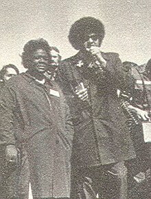 A photograph in which George Wiley (a founder and executive director of the National Welfare Rights Organization) is on the right, and its first chair and later executive director welfare activist Johnnie Tillmon is on the left.