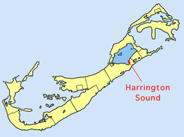 Map of Bermuda, with the island stretching from the top right corner to the bottom left corner of the image. A a large body of water in the middle of the island is labeled as Harrington Sound.