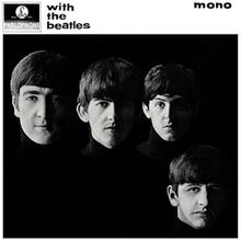 A black-and-white photograph of the Beatles' faces on a black background with the band members wearing black turtleneck sweaters