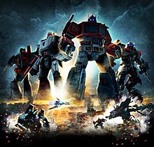 Poster showing Generation 1 (G1) Optimus Prime, G1 Megatron, G1 Starscream, and movie versions of Sideswipe, Jetfire and Soundwave. Four robots are oversized for the poster, and are shown over an Egyptian city. Below Soundwave is shown in both robot and vehicle modes on the left, while Jazz and Jetfire are shown in robot mode on the right.