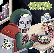 Illustration of a masked man sitting down at a table eating from packaged foods while another masked man sits under the table reading a book.