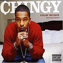 The cover features a man wearing a long sleeve red shirt and blue jeans, sitting on a hotel bed. The main artist's name appears behind him colored in white. Below the main artist's name is both the song title and the featured artist's name, colored in red.