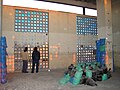 Sizing up a window grid. The sandbags around the concrete columns were placed there for the implosion, which never took place. June, 2006