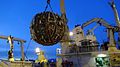 The KM3NeT LOM – the launching vehicle of Optical Modules – being loaded onto the RV Pelagia deployment vessel. A full string detection is rolled onto the LOM. After arrival at the seabed the string is unrolled to its full length.