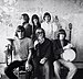 Jefferson Airplane photographed by Herb Greene at The Matrix club, San Francisco, in 1966. Top row from left: Jack Casady Grace Slick, Marty Balin; bottom row from left: Jorma Kaukonen, Paul Kantner, Spencer Dryden. A cropped version was used for the front cover of Surrealistic Pillow.