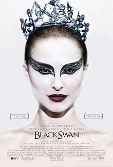 The poster for the film shows Natalie Portman with white facial makeup, black-winged eye liner around bloodshot red eyes, and a jagged crystal tiara.