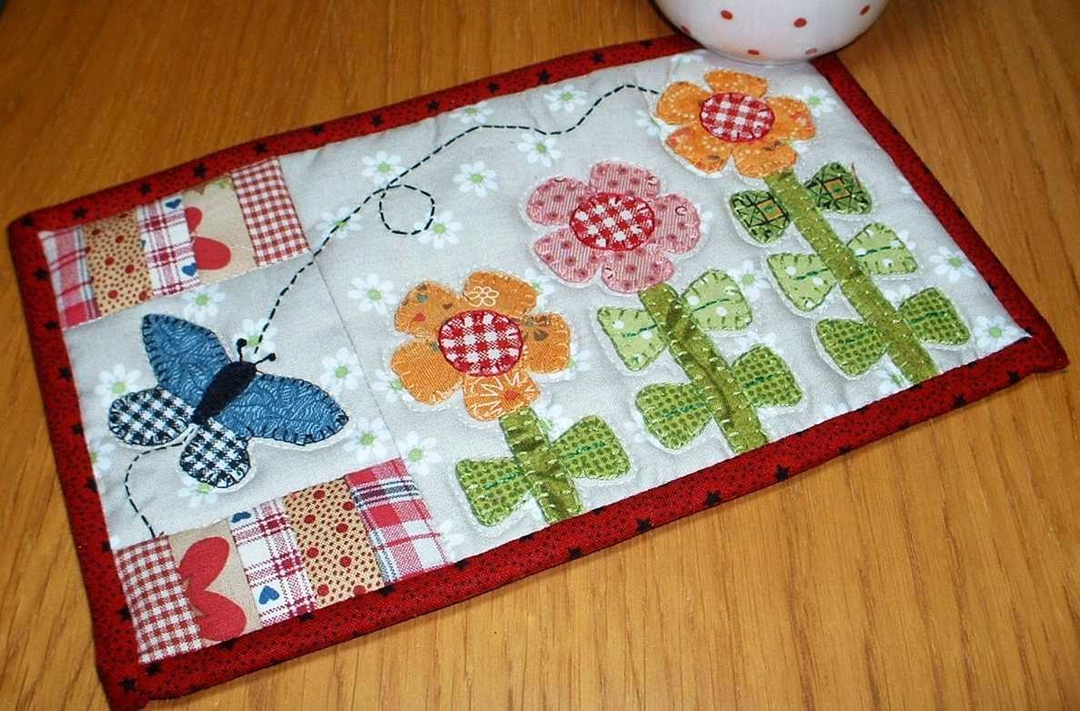 http://www.craftsy.com/pattern/quilting/home-decor/growing-flowers-mug-rug/47635