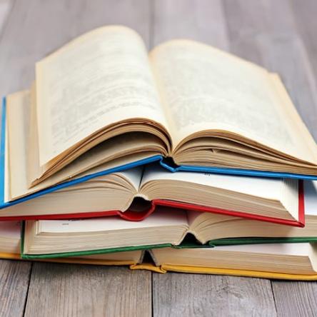 A stack of open hardcover books, Literature Resource Center