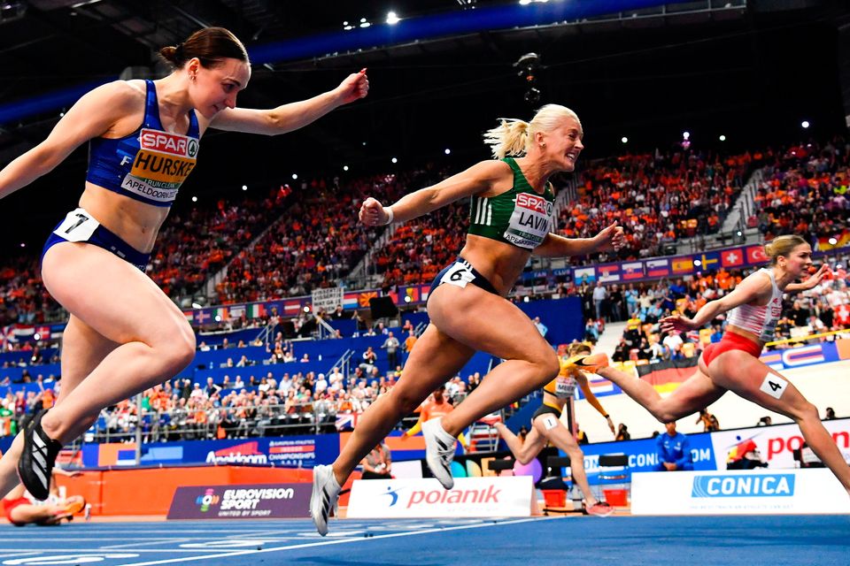 Sarah Lavin, centre, crosses the finish line to finish fourth in the women's 60m hurdles final during day two of the European Athletics Indoor Championships 2025 at the Omnisport Apeldoorn in Apeldoorn, Netherlands. Photo: Sam Barnes/Sportsfile