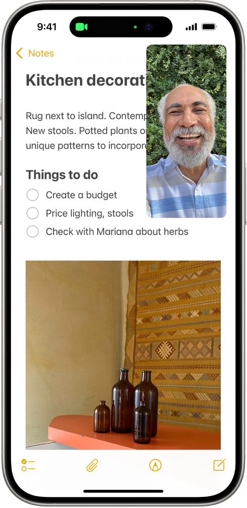 A FaceTime conversation taking place, while a note about kitchen decorating fills the rest of the screen.