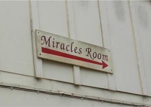 MIRACLES ROOM sign