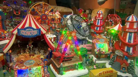 A miniature model of Hull Fair, complete with lights and moving rides.