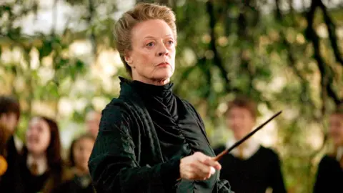 Dame Maggie with wand in Harry Potter film 