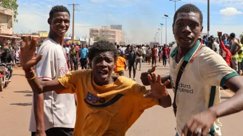 EPA Local residents react near the site of an attack in Bamako, Mali, 17 September 2024.