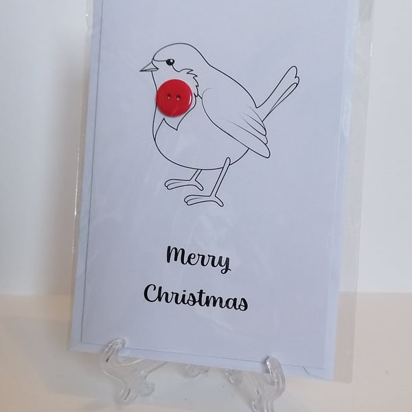 Christmas card with red button on a robin's chest