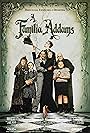 Christina Ricci, Raul Julia, Christopher Lloyd, Anjelica Huston, Judith Malina, Carel Struycken, and Jimmy Workman in A Família Addams (1991)