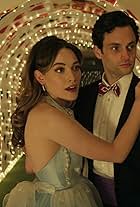 Penn Badgley and Victoria Pedretti in We're All Mad Here (2021)