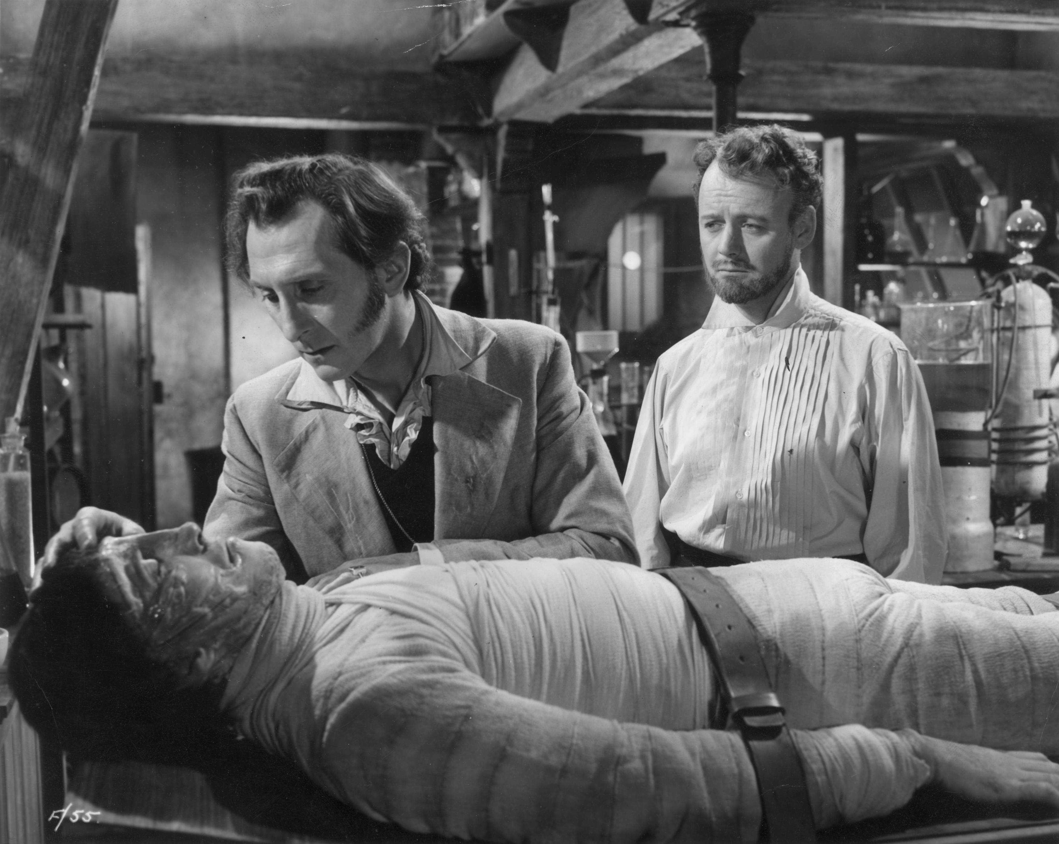 Christopher Lee, Peter Cushing, and Robert Urquhart in The Curse of Frankenstein (1957)