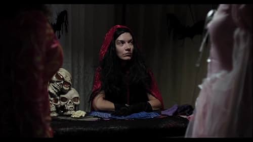 Genoveva Rossi plays a witchy fortuneteller, which is exactly the sort of the role Genoveva is the most known for.