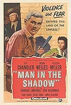 Orson Welles, Jeff Chandler, and Colleen Miller in Man in the Shadow (1957)