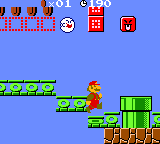 A screenshot of World 2-1 (VS Game) in Super Mario Bros. Deluxe, showing, among other things, Mario, a Boo, Face Blocks, Dotted-Line Blocks, and trampolines.