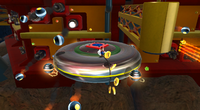 Mario collecting coins and dodging obstacles on the Moving Saucer planet in Battlerock Galaxy.