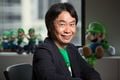 Miyamoto with several Luigi plushies for the Year of Luigi