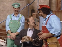 Doc Freud taking notes on Mario and Luigi's problem in The Super Mario Bros. Super Show! episode "A Basement Divided."