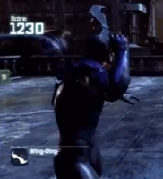 Nightwing holding a Wing-Ding in Arkham City.