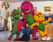 A photo of Sheryl Leach and the dinosaurs, taken in 1995.